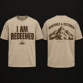 I Am Redeemed Tee in sand with brown distressed lettering and mountain back graphic